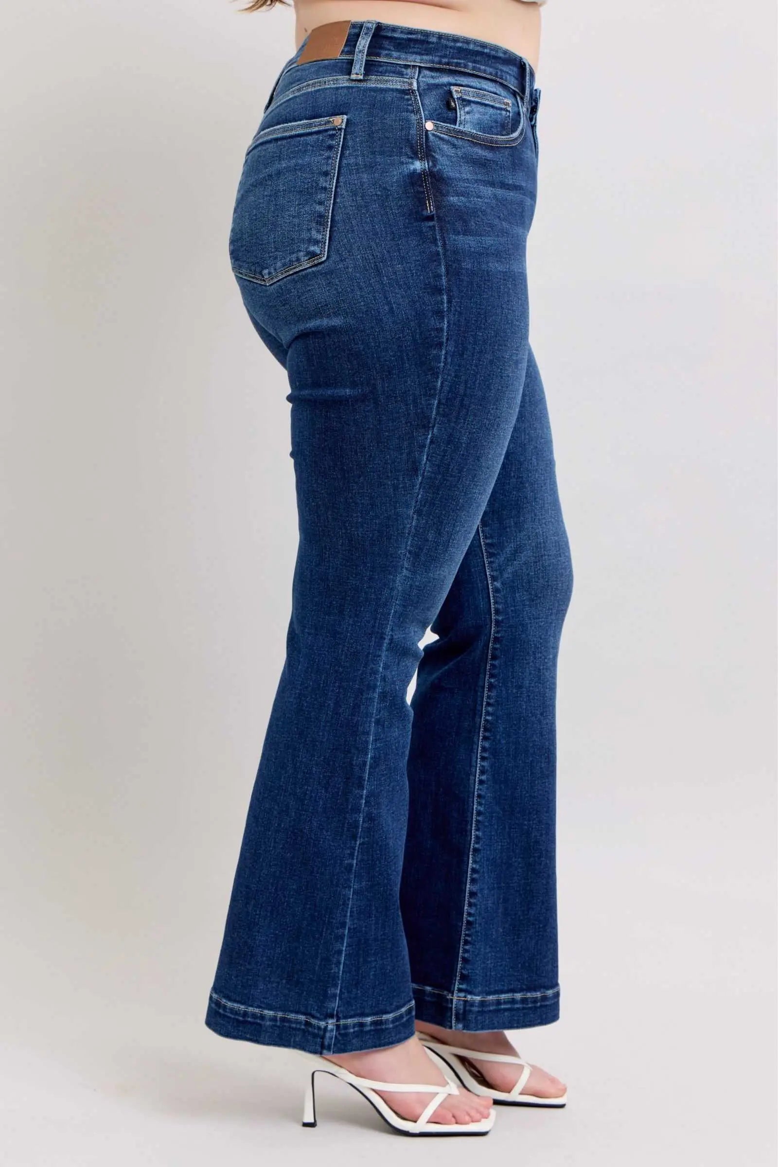 Judy Blue full size high rise flare jeans with pockets for plus size, side view.