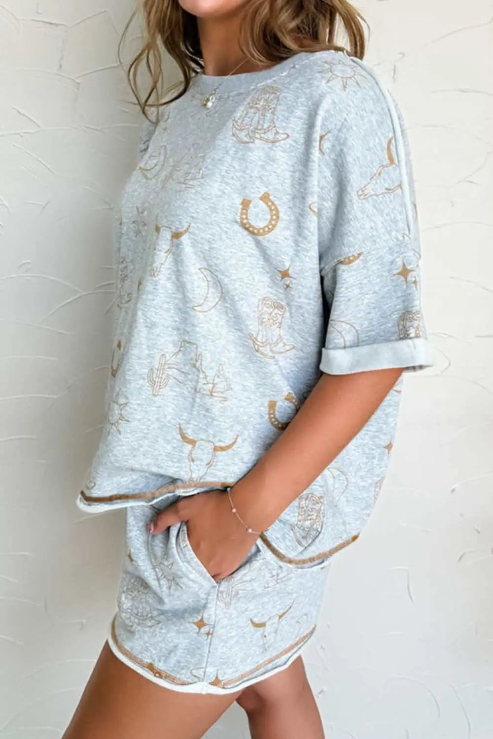 Printed T-shirt and elastic waist shorts set with soft, casual design.
