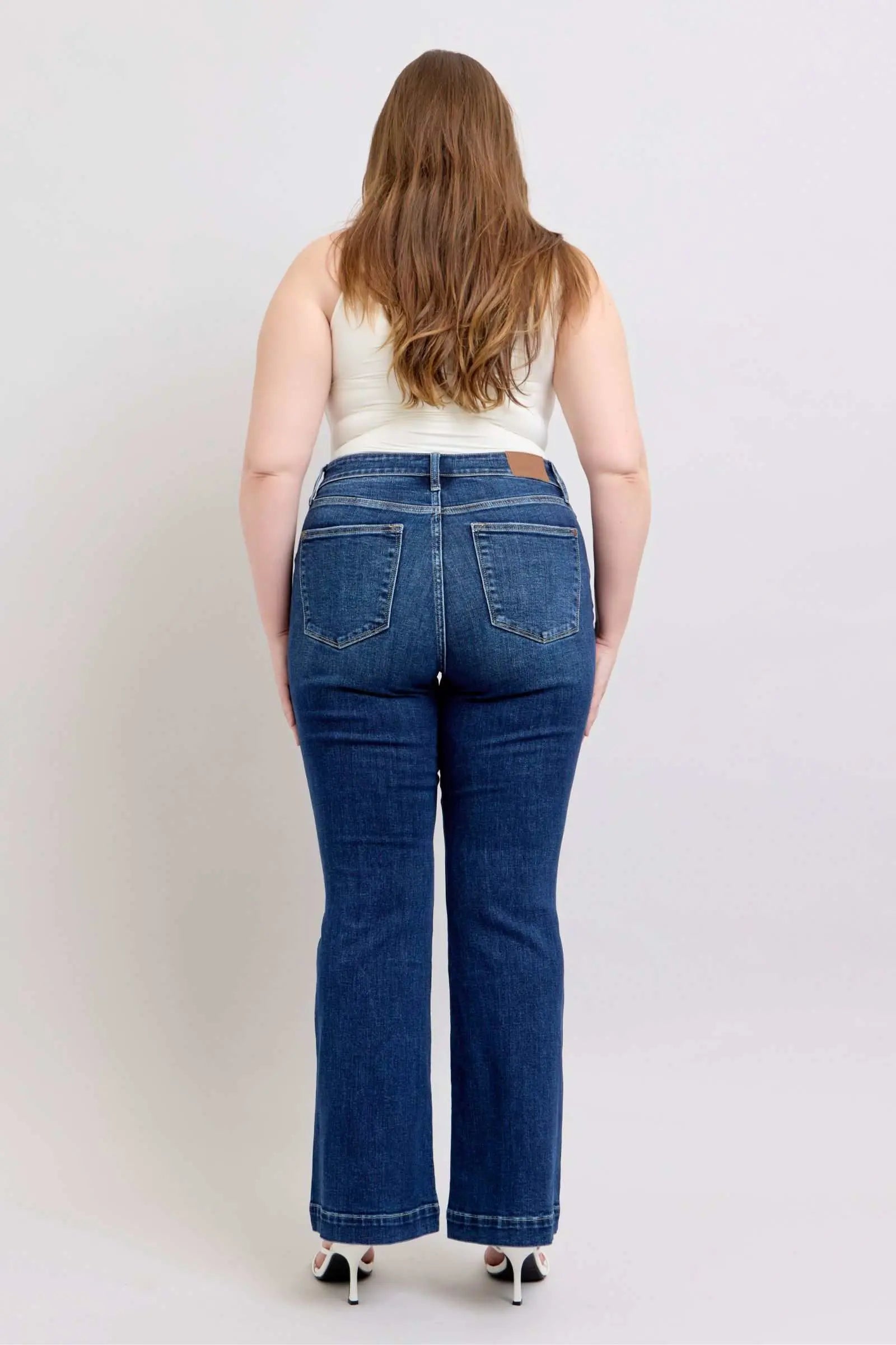 Judy Blue Full Size High Rise Flare Jeans with Pockets Plus Size, showing back view on model.