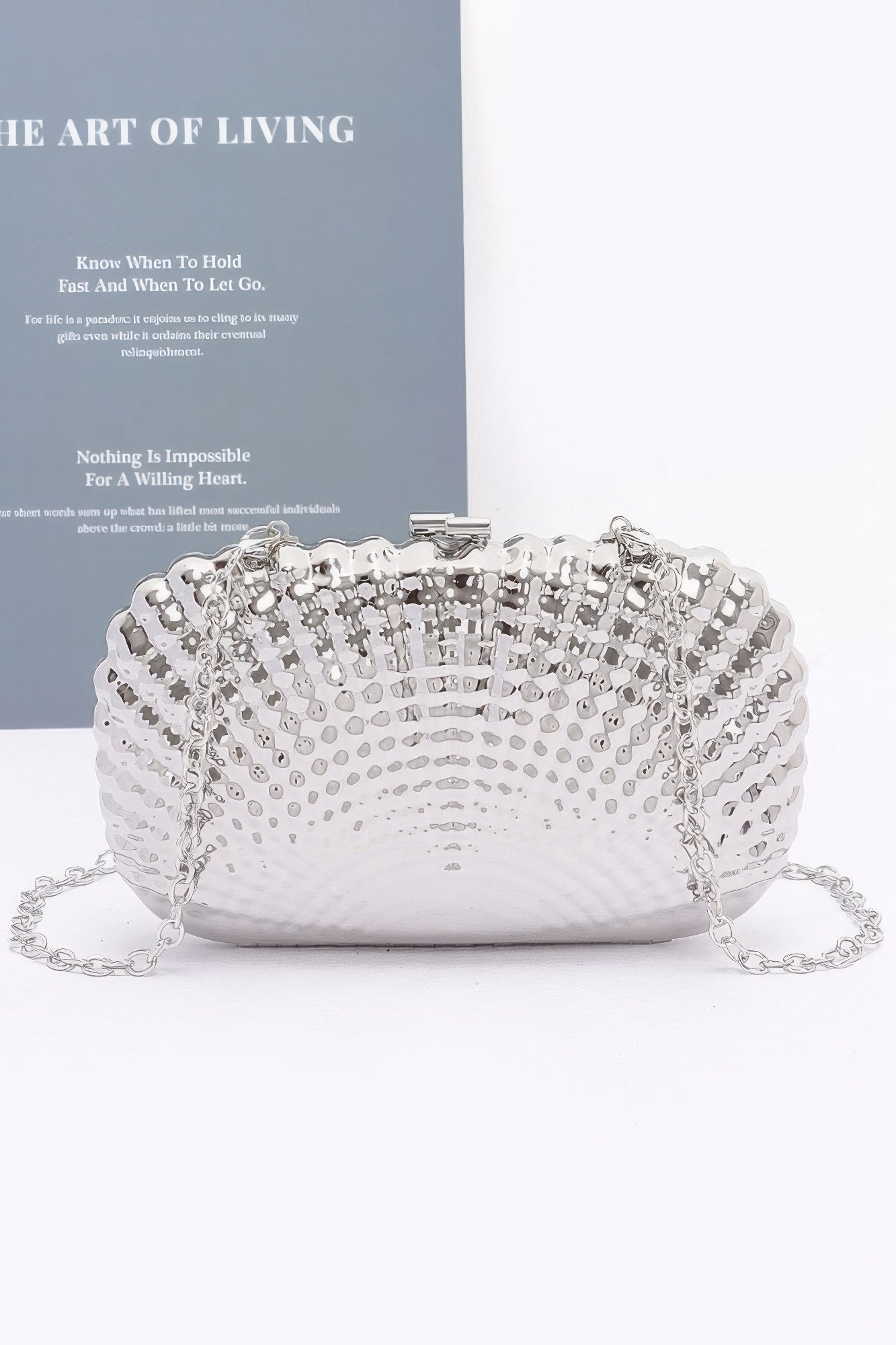 Metal clutch for women featuring a detachable chain strap for versatile wear