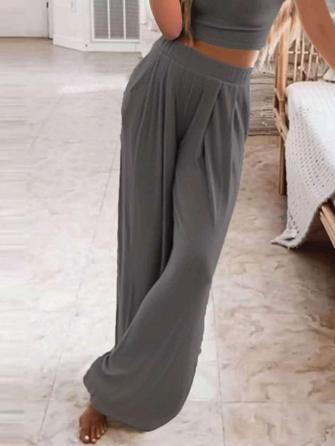 Plus size round neck short sleeve top and pants set in gray, slightly stretchy fabric.