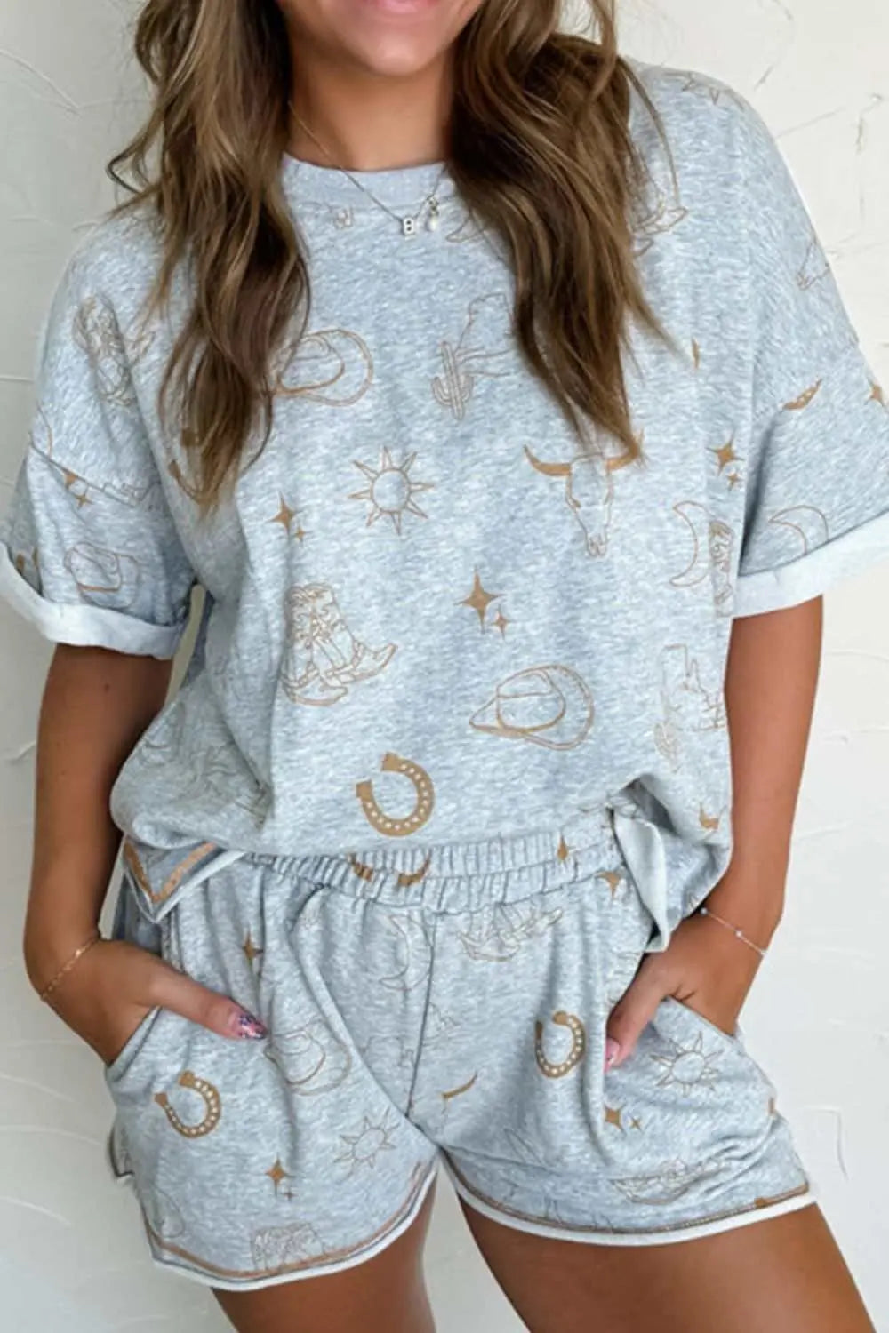Printed T-shirt and shorts set with graphic pattern, featuring a basic style and elastic waist.