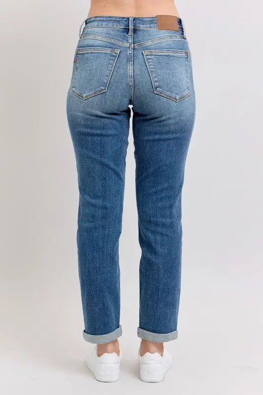 Plus size Judy Blue mid rise skinny cuff jeans with pockets, back view.