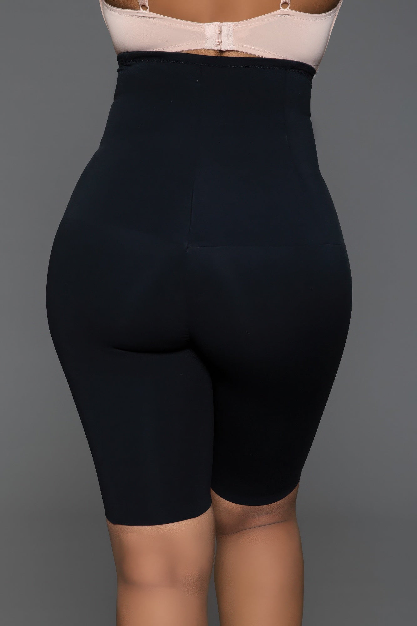 Back view of low back shapewear shorts demonstrating discreet low back cut