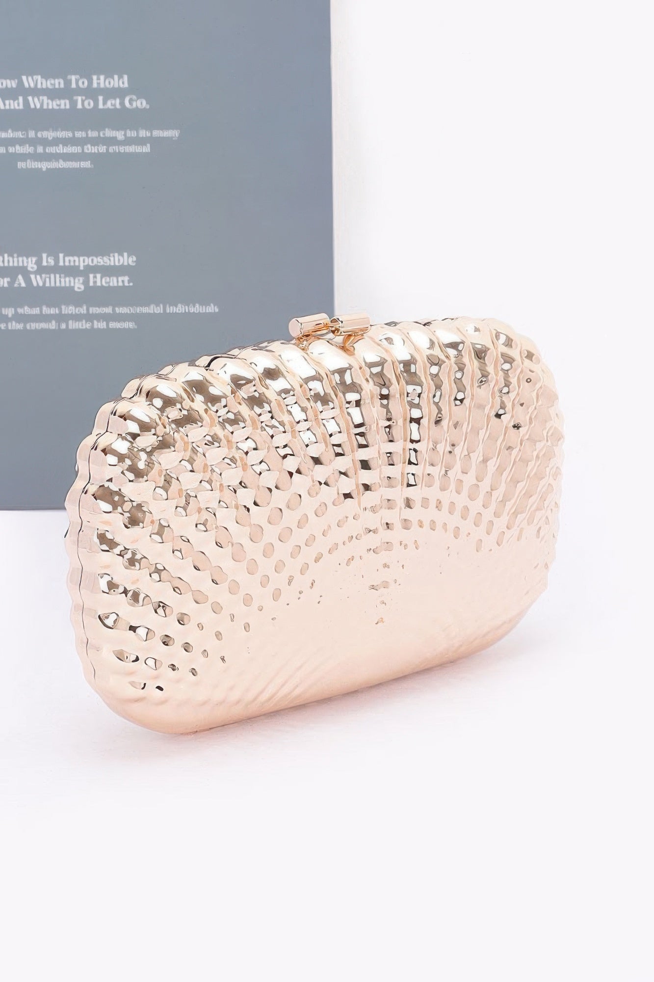 Metallic clutch styled with an evening outfit – perfect for formal events