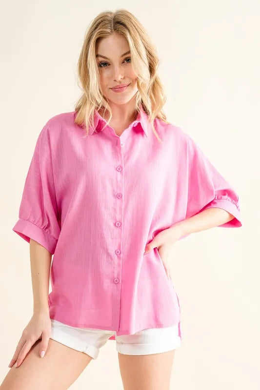 Front view of an oversized linen shirt for women showcasing relaxed fit and button-down design