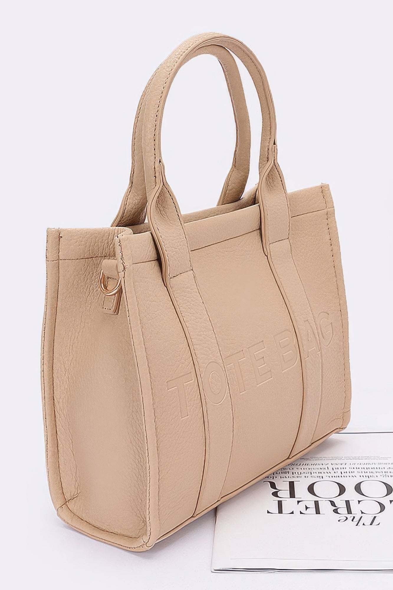 Side view of pink women's tote bag in faux leather finish
