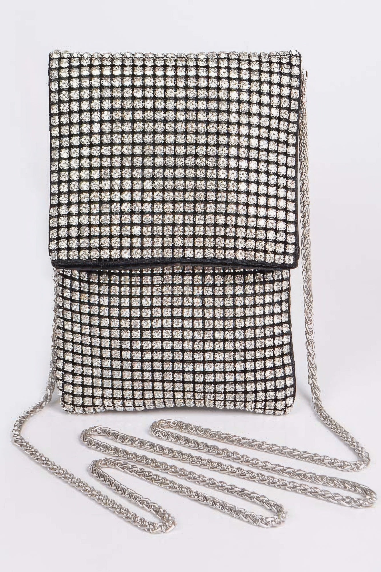  Front view of a black rhinestone purse with oversized rhinestone embellishments.