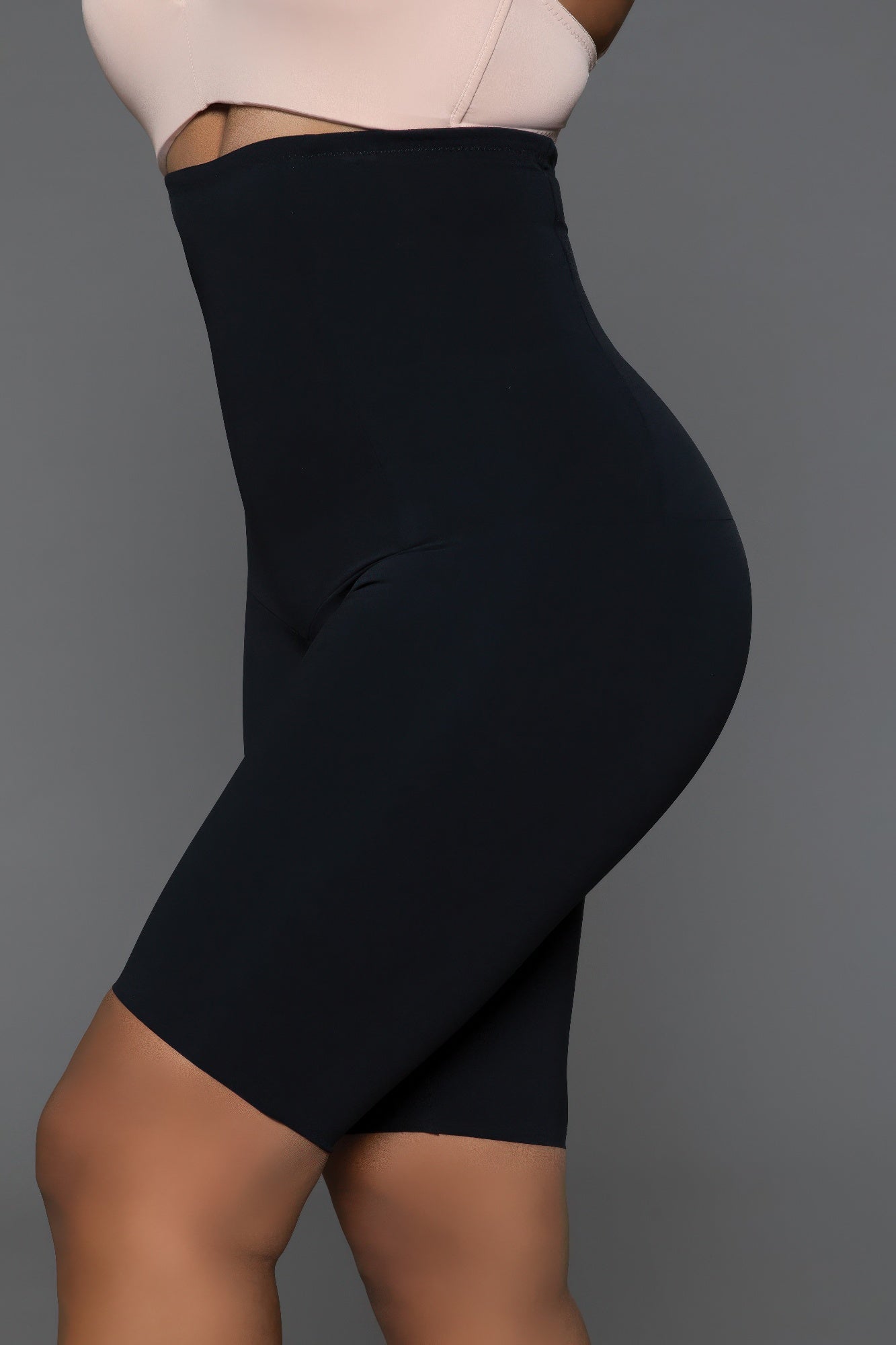 Side view of shapewear shorts showcasing thigh slimming and smooth silhouette