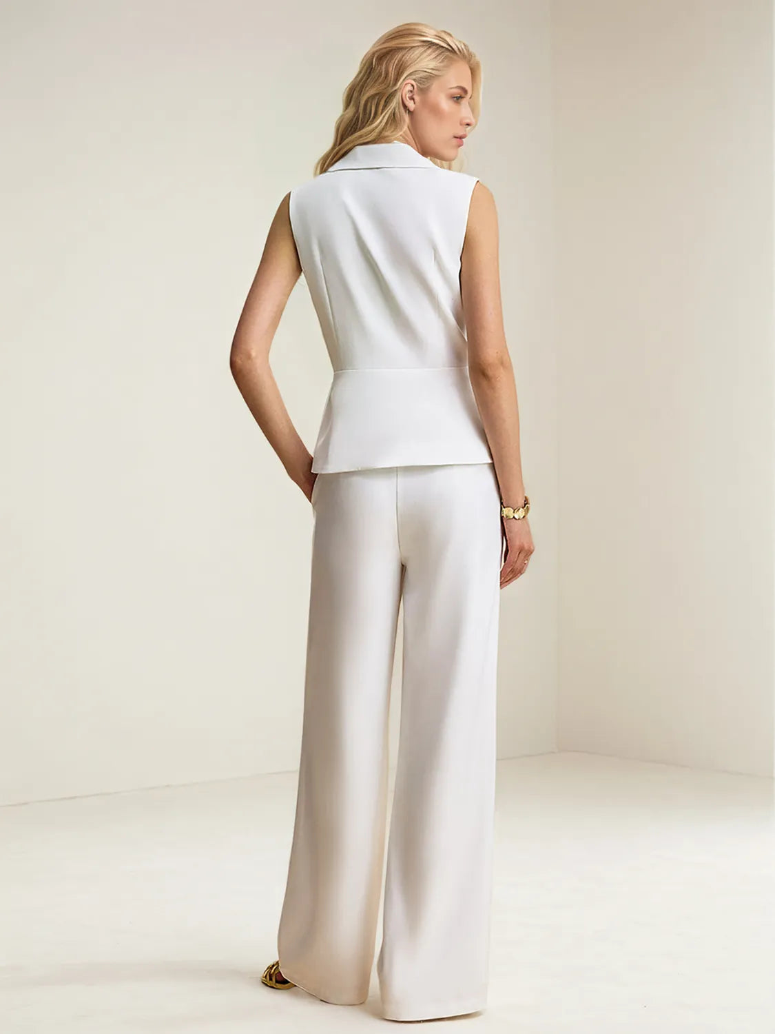 Back view of the women vest and pants set showing adjustable vest strap and pant fit